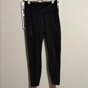 Women’s black Athleta leggings with zipper pockets
